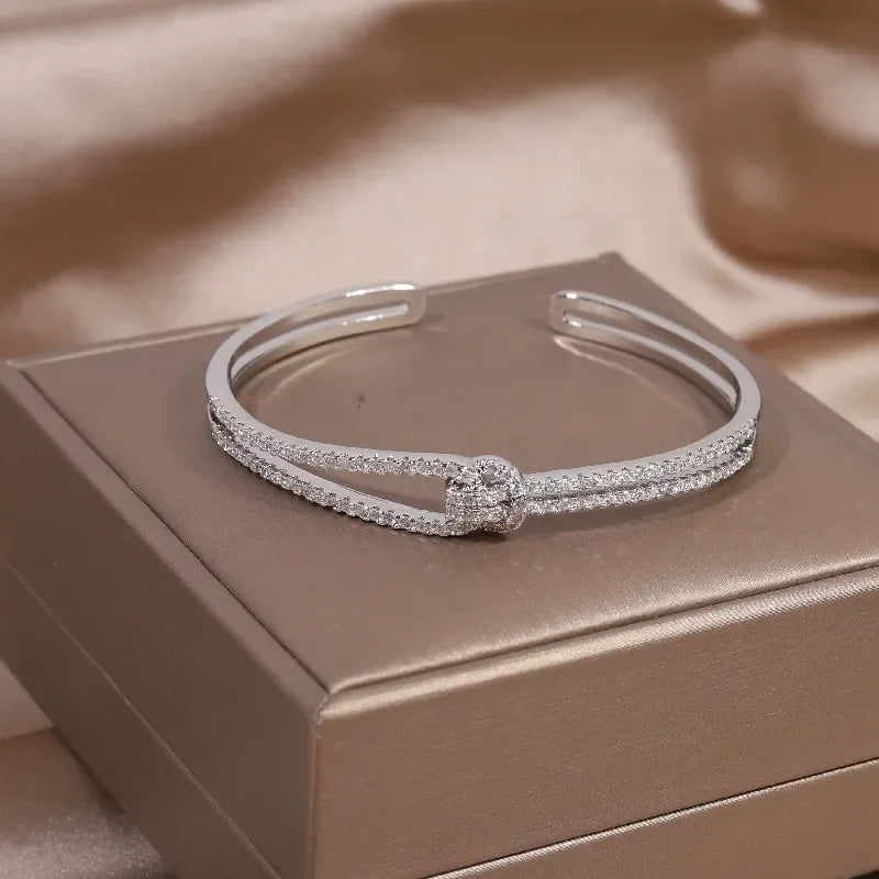 Plated zircon letter X opening bracelet