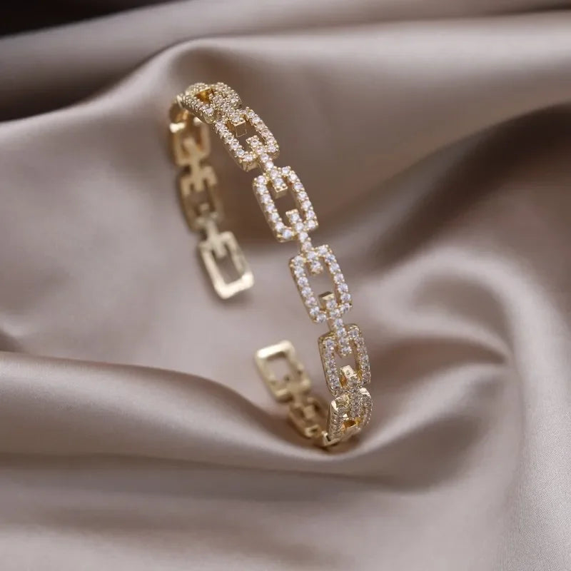 Plated zircon letter X opening bracelet