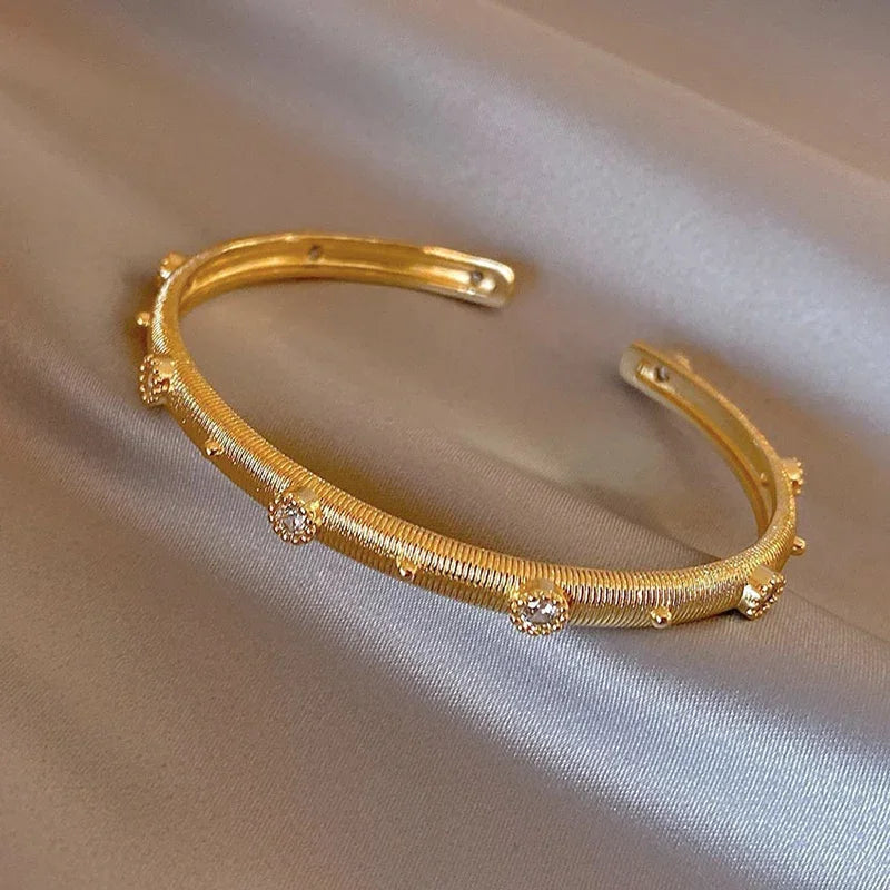 Plated zircon letter X opening bracelet