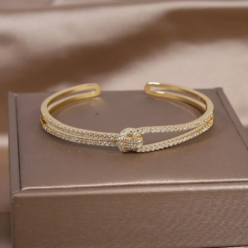 Plated zircon letter X opening bracelet